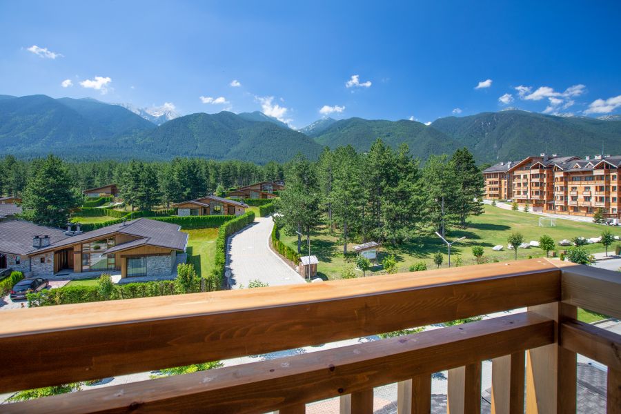 Balcony view of resort and mountains in the distance at Pirin Golf And Country Club