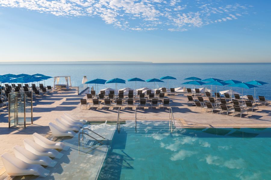 Sun loungers with blue sky overhead at Elba Sunset Mallorca Thalasso Spa Hotel