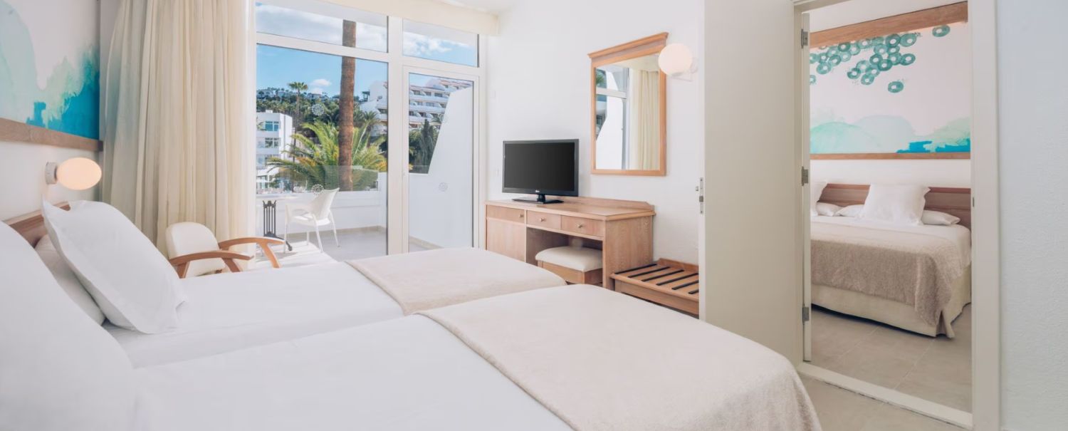 Television on desk in twin bedded room at Iberostar Waves Las Dalias
