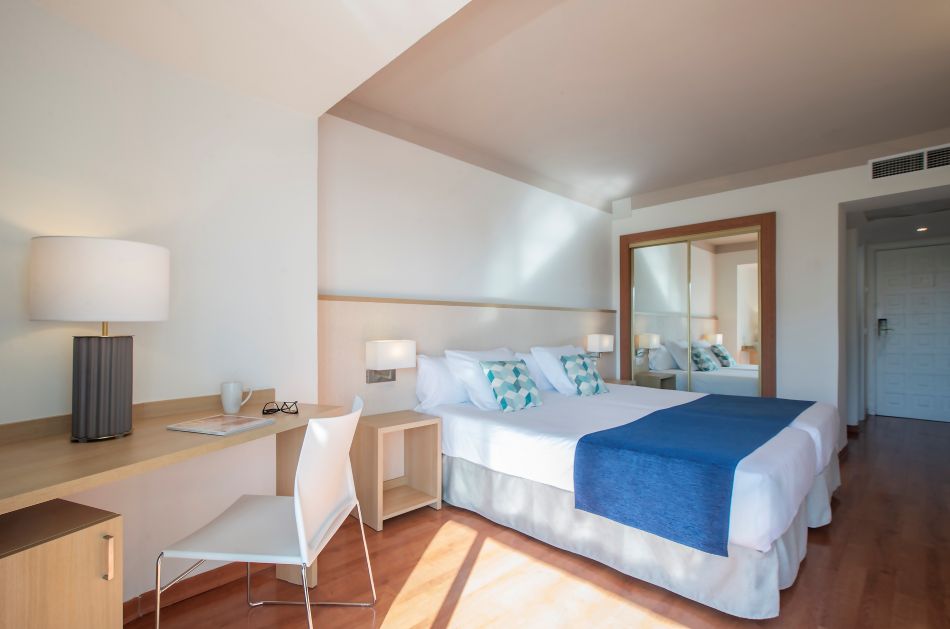 Desk with chair in bedroom at Hotel Costa Malaga