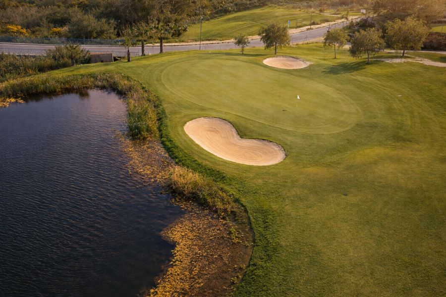 Hole 5 with lake to left of green at Azata Golf in Spain