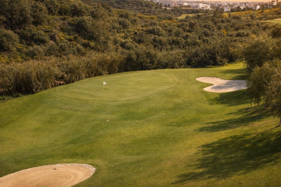 Two sand bunkers protecting the green on hole six at Azata Golf