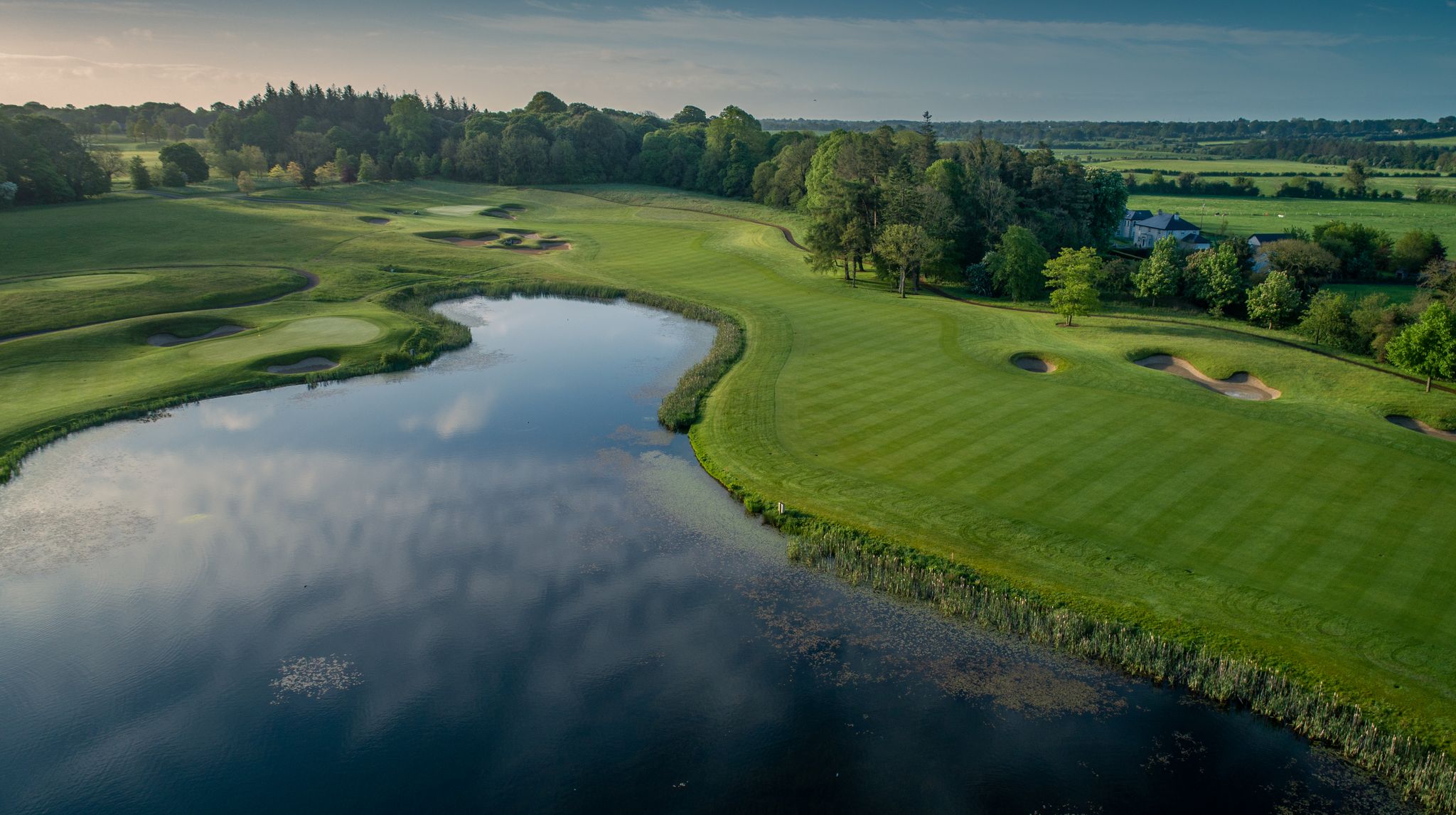 Large blue lake on left hand side of green fairway at Killeen Castle
