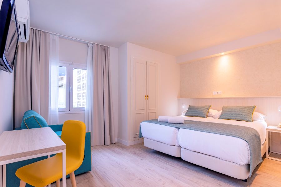 Twin beds in hotel room at Hotel Palmasol Benalmadena in Spain