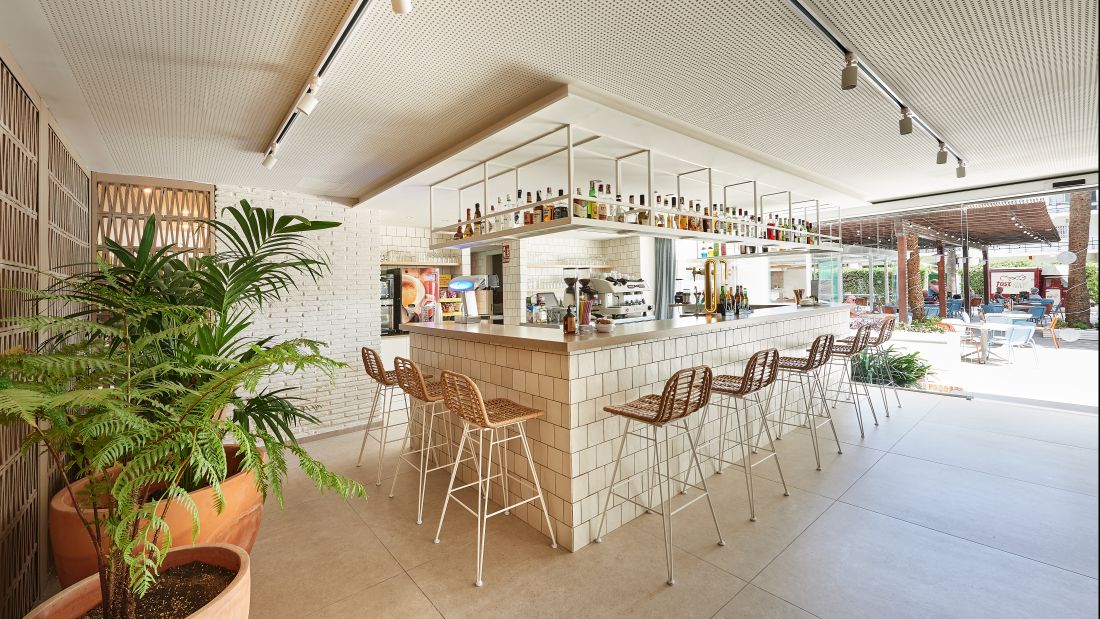 Bar with metro tiles and stools at Hotel Palmasol Benalmadena